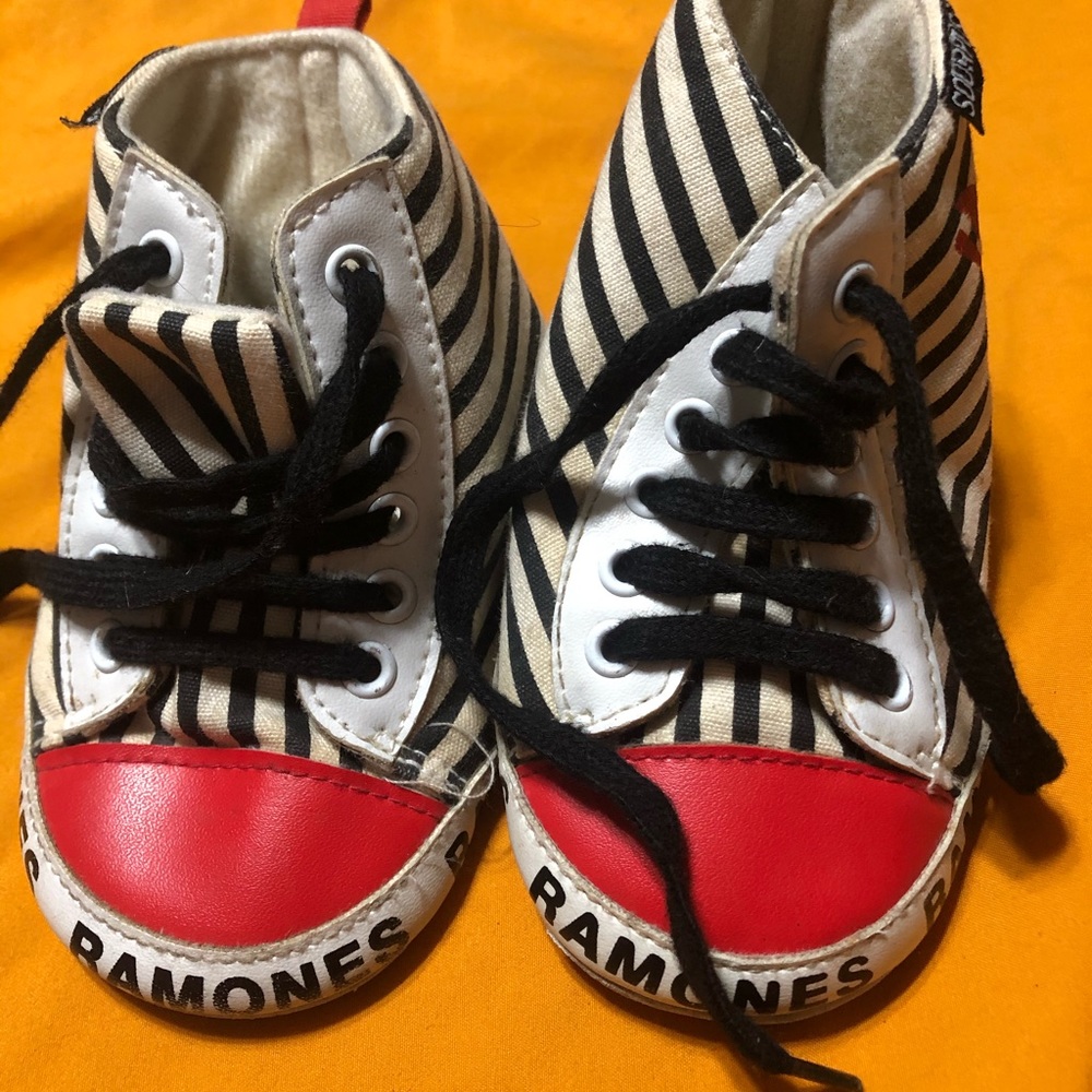 2 pair of sourpuss crib shoes